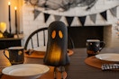 Way to Celebrate Paper Mache Ghost table decoration as the centerpiece in a Halloween-themed dining room