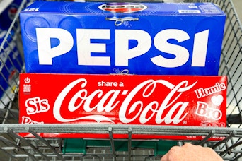 coca-cola and pepsi soda 12-packs in shopping cart