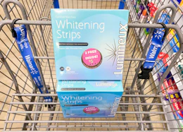 box of Lumineux teeth whitening strips in a Walmart cart