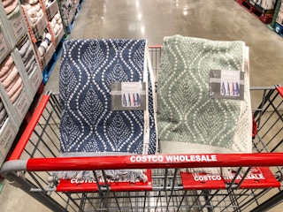 blue or green bath towels in a cart