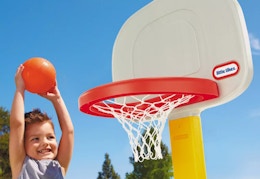 child playing with the Little Tike basketball hoop