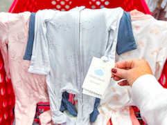 cloud island baby sleep n' plays sitting on top a target cart