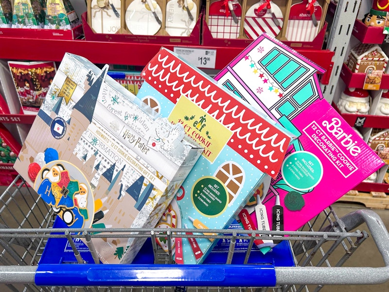 harry potter, elf, and barbie cookie decorating kits in a cart