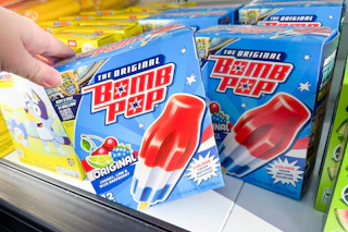 hand grabbing a box of bomb pops
