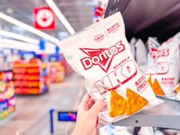 A bag of Doritos NKD Chips held in Walmart store in the grocery aisle