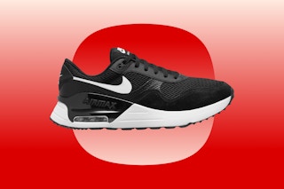 A black-and-white Nike sneaker on a red background