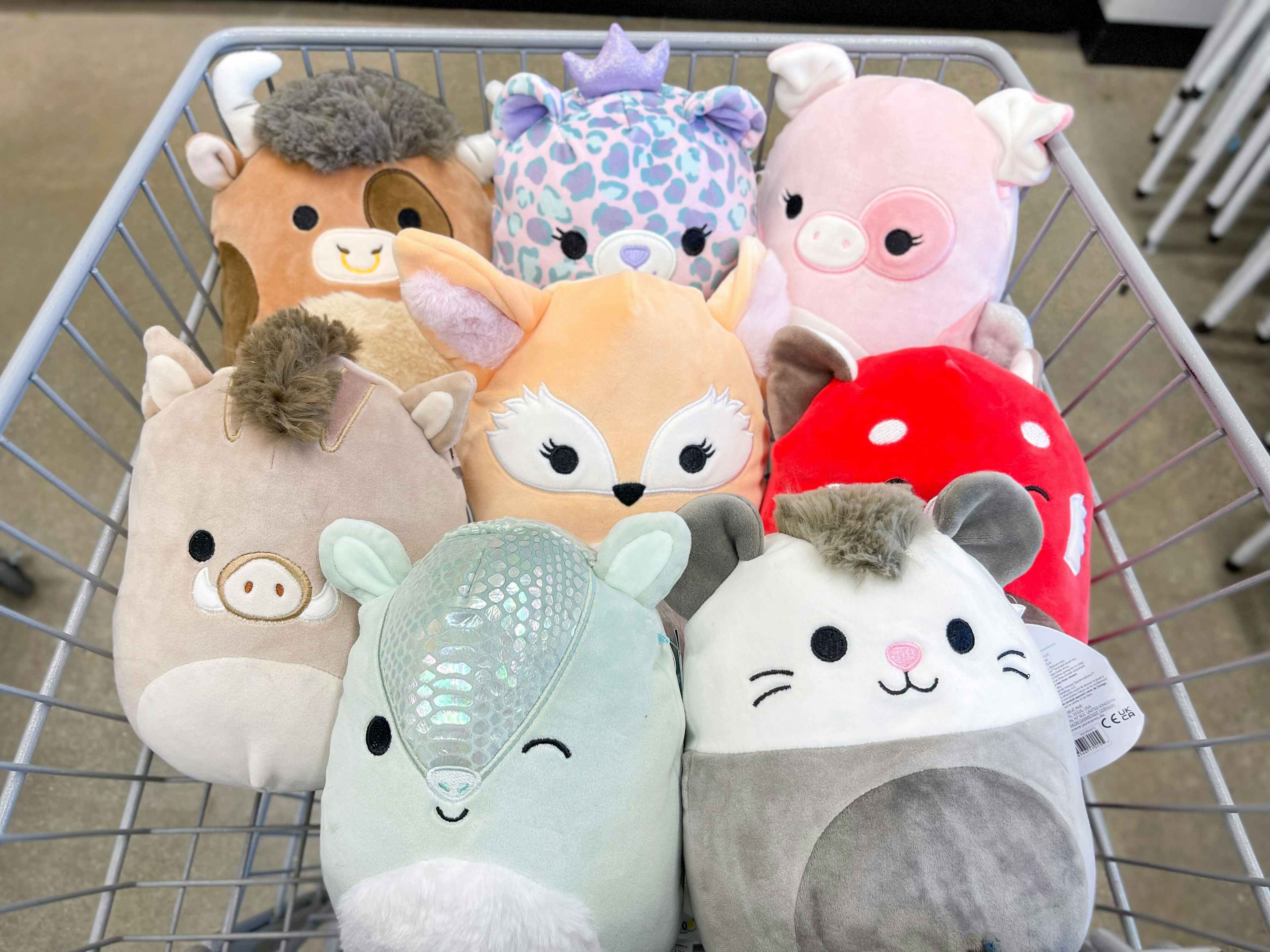a bunch of squishmellows in a cart 