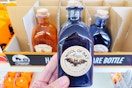 hand holding a halloween decorative bottle at dollar tree
