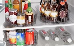 jars and bottles on lazy Susans in a fridge 