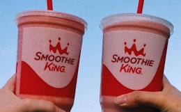 two people holding smoothie king cups. taken from their instagram