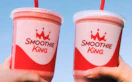 two people holding smoothie king cups. taken from their instagram