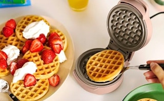 waffles on a plate next to a mini waffle maker