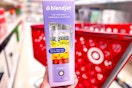hand holding a blendjet portable blender in front of target cart