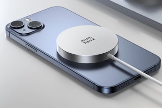 Qi2 Magnetic Wireless Charger charging a phone on a counter.