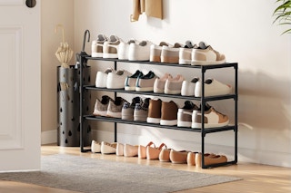rack holding an assortment of shoes by entryway