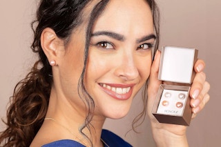 Woman holding a boxed set of Honora Cultured Pear Earring Sets