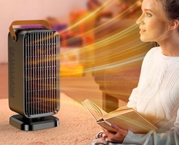 a person sitting in front of a heater