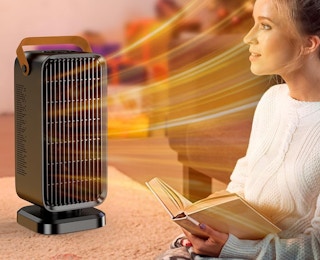 a person sitting in front of a heater