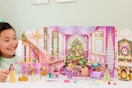 a girl playing with a disney princess advent calendar