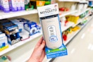 hand holding a thermacell mosquito repeller in front of target shelves