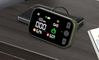 a gas and carbon monoxide detector plugged into a wall 