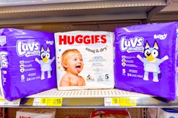 luvs and huggies diapers on store shelf