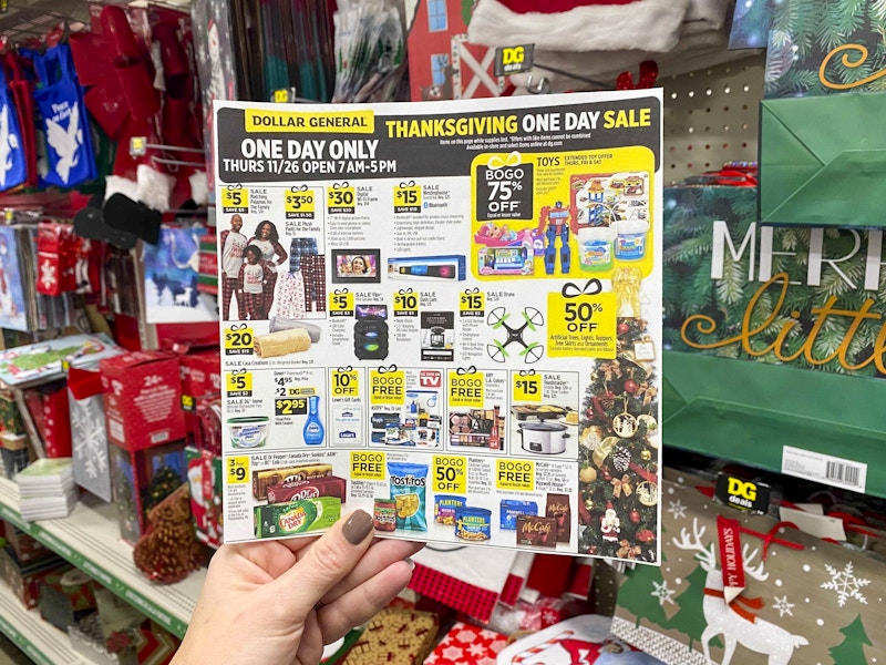 Hand holding Dollar General Black Friday ad