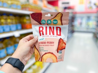hand holding bag of Rind dried fruit snacks