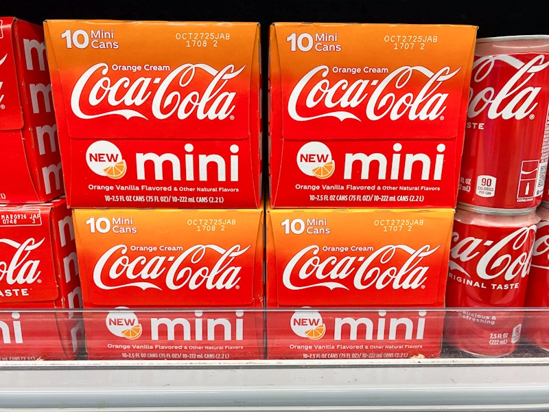 coca-cola orange cream sodas stacked on walmart shelf