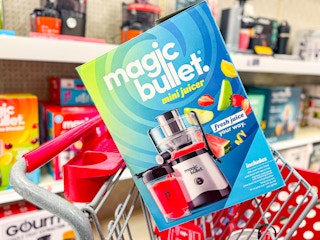 magic bullet mini juicer sitting on top a target cart