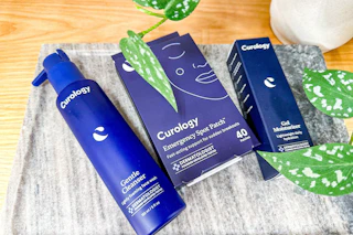 3 curology skincare products on a table at target