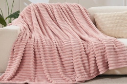 NEWCOSPLAY Super Soft Throw Blanket draped on a couch.