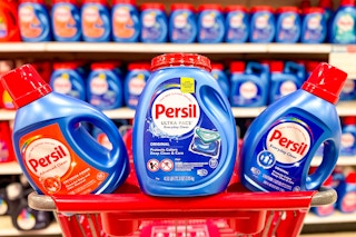 3 persil laundry detergent sitting on a target cart