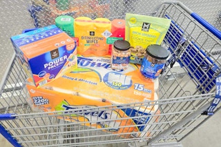 cart full of members mark products at sams club including snacks, paper towels, and more