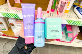 hand holding global beauty care beauty products at dollar tree
