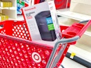 honeywell allergen plus air purifier sitting on top a target cart