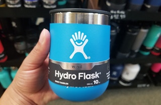 someone holding a hydro flask