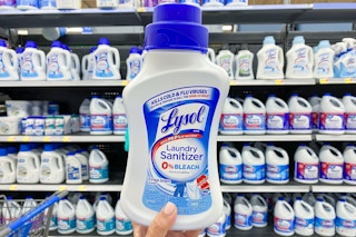 person holding a bottle of lysol laundry sanitizer