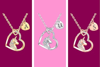 Gold, silver, and rose gold necklaces with a unicorn in a heart and an initial on a smaller heart, plus sparkles