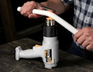a person using a heat gun