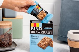 someone grabbing a Kind Breakfast Bar