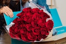 a woman opening roses