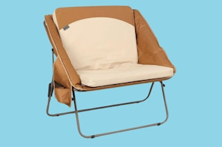 padded brown camping chair on a blue background