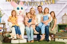 young child taking a photo with the easter bunny at cabelas