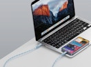a laptop charging a smartphone