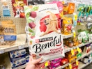 person holding a bag of beneful dog food