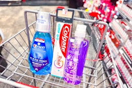 crest mouthwash, colgate toothpaste, maybelline eyeshadow, and safeguard hand soap in a cart