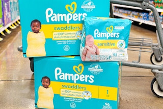 pampers diapers and wipes in store floor in front of shopping cart