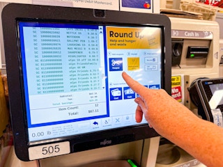 a person checking out at the register at Kroger