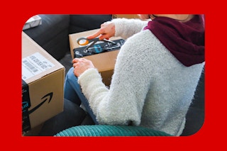 a woman opening an amazon box